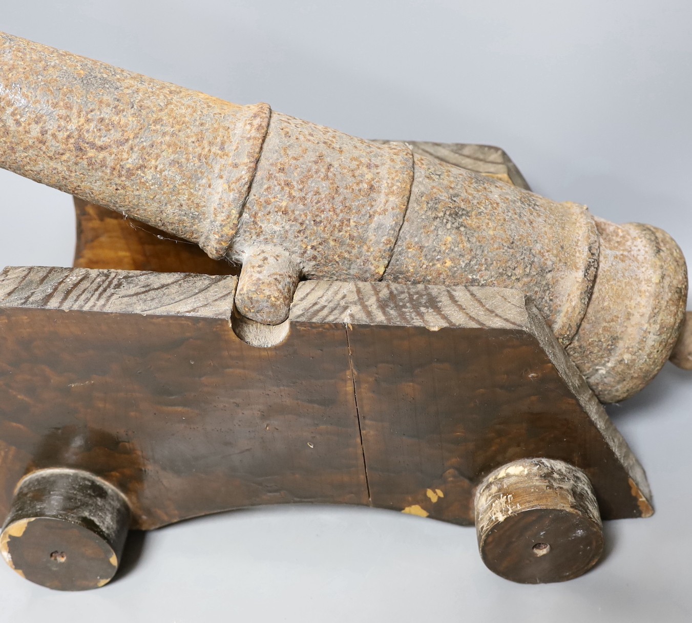 Two 19th century cast iron small cannon, on later wheeled carriages and related diagrams, largest 43 cms long.